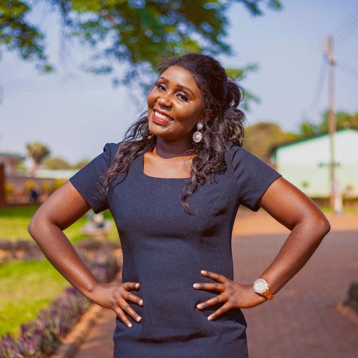 Avery Chen, Lead Design Curator at RidgeHavenAtlas, reviewing corporate floral arrangements